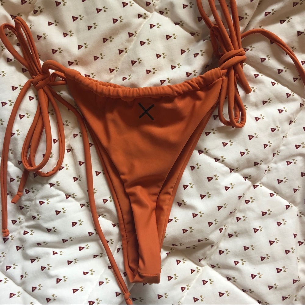 Brand new never used boutine burnt orange bottom